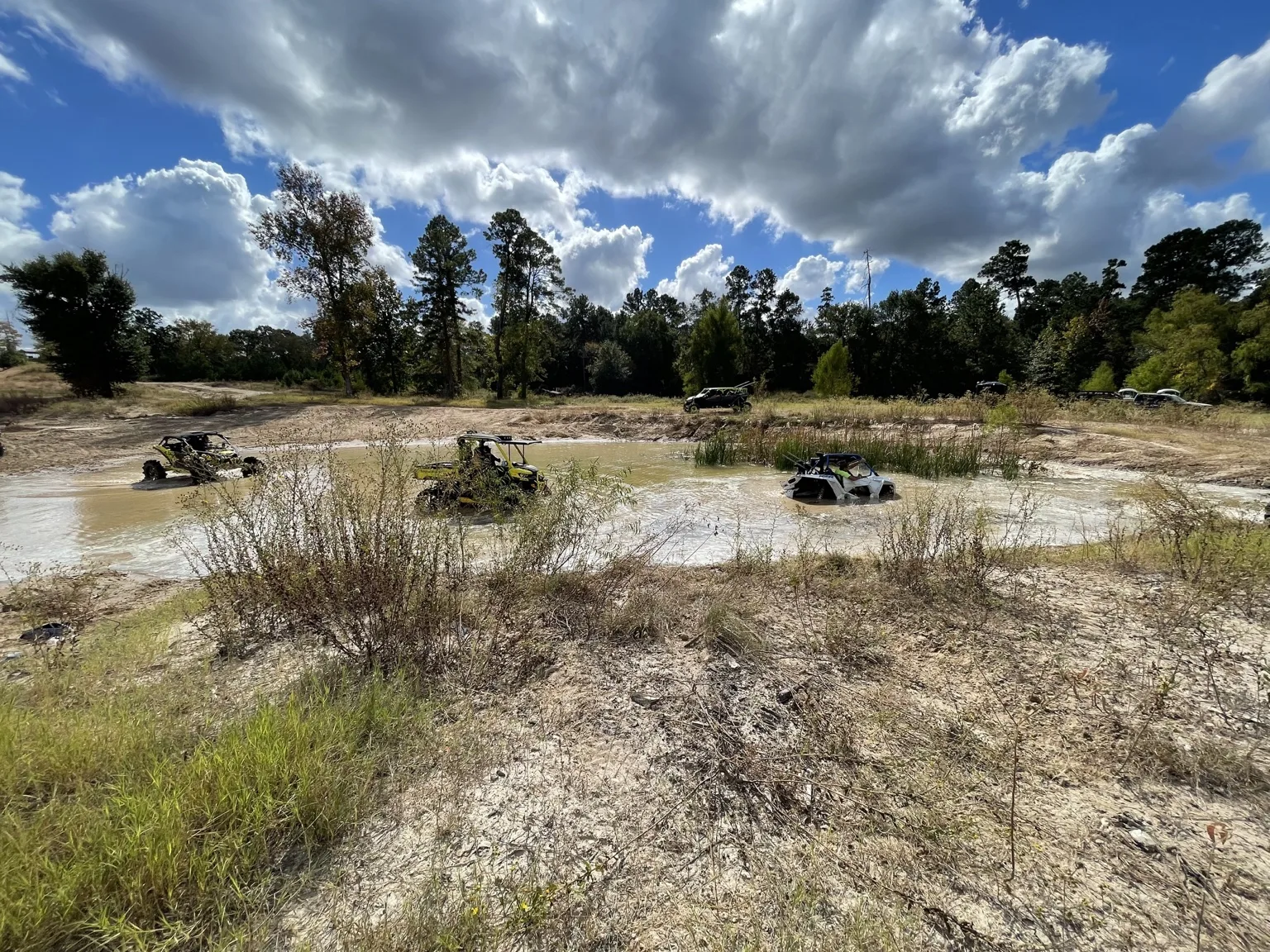 Off-road riders crossing water together